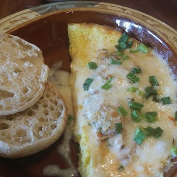 Another Broken Egg Cafe - The Floridian omelet with a sliver of cream cheese which I couldn't taste and crab meat on top. - Cafes Near Me - Memphis, Tennessee