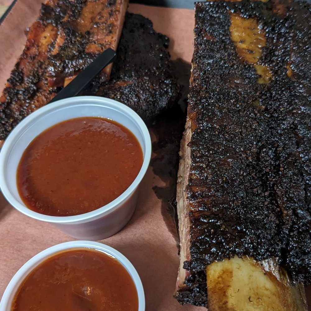 Pork ribs and a beef rib. Pork ribs and a beef rib.