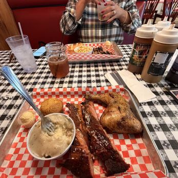 Smoking Pig BBQ - 2-Meat Combo featuring a flavorful chicken leg quarter, tender pork spareribs, creamy mashed potatoes with gravy. - Barbeque Near Me - Las Vegas, Nevada