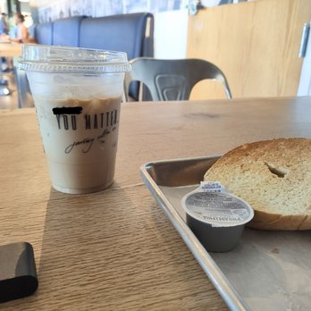 Journey Coffee - Iced latte and toasted bagel with cream cheese. FYI the WiFi password is on the cup, all one word, all small letters - Coffee & Tea Near Me - Fairfield, California