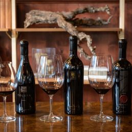 three bottles of wine and two glasses of wine three bottles of wine and two glasses of wine