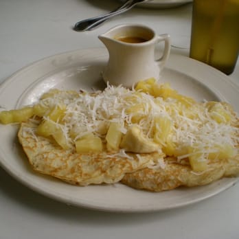 Key Largo Conch House - banana, pineapple, and coconut pancakes with passionfruit syrup - Seafood Near Me - Key Largo, Florida Key Largo Conch House - banana, pineapple, and coconut pancakes with passionfruit syrup - Seafood Near Me - Key Largo, Florida
