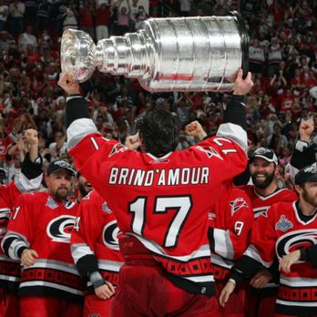 Carolina Hurricanes - Rod Brind'Amour lifting the Stanley Cup after the Hurricanes won in 2006. - Professional Sports Teams Near Me - Raleigh, North Carolina Carolina Hurricanes - Rod Brind'Amour lifting the Stanley Cup after the Hurricanes won in 2006. - Professional Sports Teams Near Me - Raleigh, North Carolina