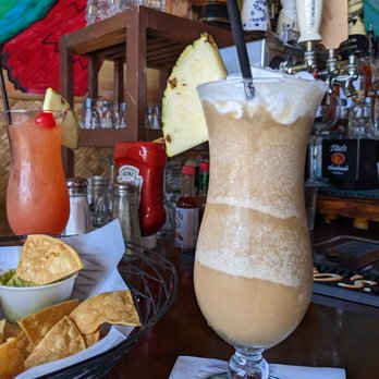 Luau Larry's - Bahama Mama and Luau Larry's Colada with Kahlua. - New American Near Me - Avalon, California Luau Larry's - Bahama Mama and Luau Larry's Colada with Kahlua. - New American Near Me - Avalon, California