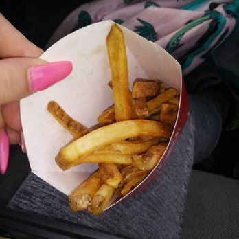 Wendy's - a person holding a basket of french fries - Fast Food Near Me - Saint George, Utah