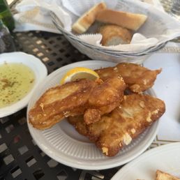 Saganaki and fresh bread with olive oil Saganaki and fresh bread with olive oil