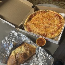 Lione's Pizza - Gluten free cheese pizza (right) and personal ham and pineapple calzone (left)