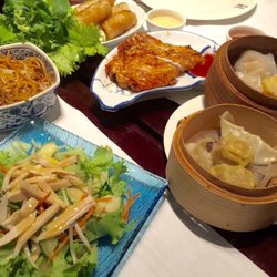 Les Fleurs du Cerisier - Starting from bottom left in a clockwise direction: Chicken salad, fried noodles, spring rolls, grilled chicken, and dim sum dumplings.