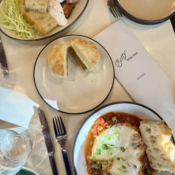Betty - Shakshuka, breakfast biscuit sandwich, and eggs/bacon plate. - Wine Bars Near Me - Sacramento, California