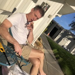 Smoking a cigar in front of our room Smoking a cigar in front of our room