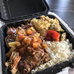 boneless jerk chicken, white rice, fire roasted vegetables