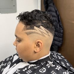Johnny's Barbershop - Hair By Henry