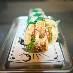 Mammoth Burger - Savor the freshness of a gyro sandwich crafted with tender grilled chicken or crispy breaded chicken, nestled atop a crisp bed of lettuce