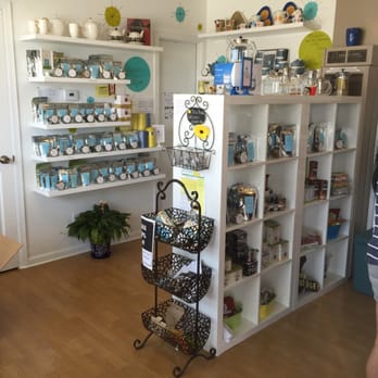 BananaDog Tea - a woman standing in front of a shelf of tea - Chocolatiers & Shops Near Me - Muskegon, Michigan BananaDog Tea - a woman standing in front of a shelf of tea - Chocolatiers & Shops Near Me - Muskegon, Michigan