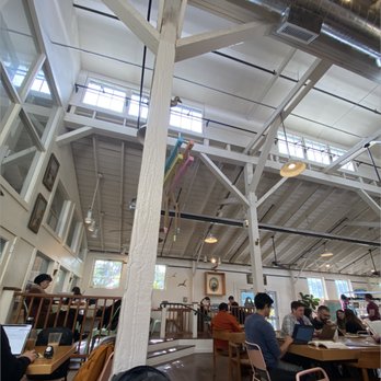 Farmers Union Coffee Roasters - Inside; All the seating is on one side of the shop and outside. - Coffee & Tea Near Me - Eugene, Oregon