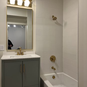 O.W. Builders - Bathroom full gut remodel (photo before shower curtain rod installation) - Handyman Near Me