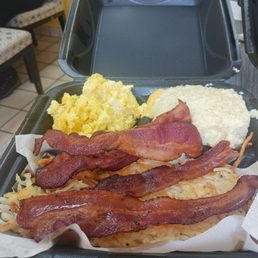 Adamsville combo. Eggs bacon hash browns grits and a pancake Adamsville combo. Eggs bacon hash browns grits and a pancake