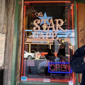 The Star Cafe - a man eating a sandwich - Burgers Near Me - Fort Worth, Texas