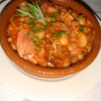 Tasca Restaurant - Rabbit and duck cazuela with white beans, smoked ham hocks and chorizo - Spanish Near Me - Brighton, Massachusetts Tasca Restaurant - Rabbit and duck cazuela with white beans, smoked ham hocks and chorizo - Spanish Near Me - Brighton, Massachusetts