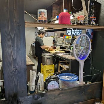 Sake Sushi - a man preparing food in a kitchen - Japanese Near Me - Ucluelet, British Columbia