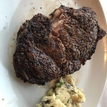 Del Frisco's Double Eagle Steakhouse - Prime ribeye and a spoon of mashed - Seafood Near Me - Boston, Massachusetts Del Frisco's Double Eagle Steakhouse - Prime ribeye and a spoon of mashed - Seafood Near Me - Boston, Massachusetts