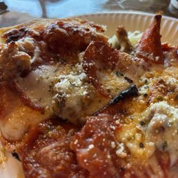 A slice of sausage and pepperoni. I already ate half of it. A slice of sausage and pepperoni. I already ate half of it.