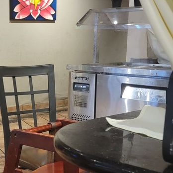 Deccan Spice - Look at the floors. black. If you zoom in on their refrigeratored case it is caked with fingerprints and grime. - Indian Near Me - Naperville, Illinois