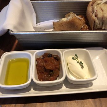 Scarpetta - Bread service accompaniments. The eggplant caponata is astronomically good. - Italian Near Me - New York, New York