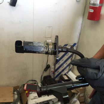 Auto Technik Carcare - The glue or silicone they used in the old part. - Auto Repair Near Me - Chino, California