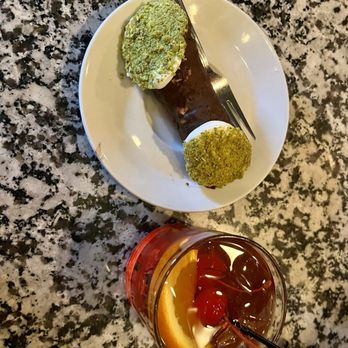 Caffé Vittoria - Chocolate Cannoli dipped in Pistachio and an Old Fashion - Coffee & Tea Near Me - Boston, Massachusetts Caffé Vittoria - Chocolate Cannoli dipped in Pistachio and an Old Fashion - Coffee & Tea Near Me - Boston, Massachusetts