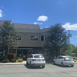 J J Dry Cleaners & Tailor - The exterior on a sunny day!