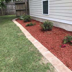 Quality Outdoors - Walkway and red mulch