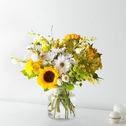 Forsberg Flowers of Marquette - Sunshine in a vase! Hello Sunshine Bouquet is bright mix of sunflowers, daisies & lush greens is perfect for any occasion...