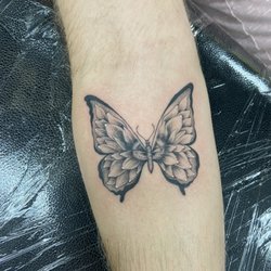 The Standard Tattoo Parlor - Butterfly with sunflower detail as the wing design