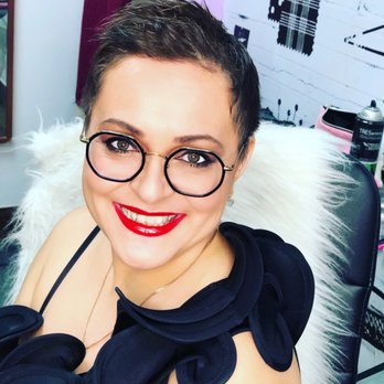 Leonidas - a woman wearing glasses and a black dress - Chocolatiers & Shops Near Me - Montreal, Quebec Leonidas - a woman wearing glasses and a black dress - Chocolatiers & Shops Near Me - Montreal, Quebec