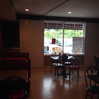 Pizza King - The white "screens" on either side of the window slide together to show the big game may be going on during football season. - Italian Near Me - Dunlap, Tennessee