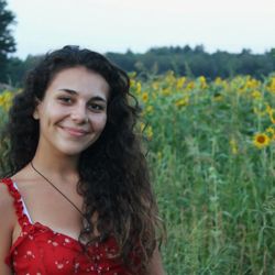 Kass Melo, she/her, Instructor for Voice, Songwriting, Beginning Piano, Beginning Guitar. Loves teaching children.