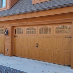 Garage Door Specialists - This is an Amarr Classica Collection with decorative hardware in medium wood grain color.