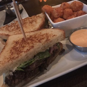 The Woolworth - Brisket sandwich with sweet potato tots and sriracha aioli - Cocktail Bars Near Me - Dallas, Texas The Woolworth - Brisket sandwich with sweet potato tots and sriracha aioli - Cocktail Bars Near Me - Dallas, Texas