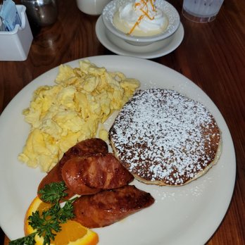 Moke’s Bread And Breakfast - The Sunrise Special #1 with Portuguese sausage and pancakes with Lilikoi sauce (sweet fruity cream on the side). - Breakfast & Brunch Near Me - Honolulu, Hawaii Moke’s Bread And Breakfast - The Sunrise Special #1 with Portuguese sausage and pancakes with Lilikoi sauce (sweet fruity cream on the side). - Breakfast & Brunch Near Me - Honolulu, Hawaii