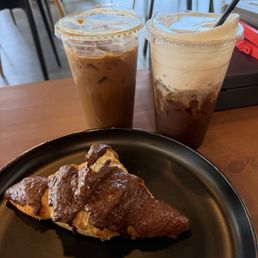 Large iced tiramisu latte, large iced blueberry cold brew with lemon soft top and a chocolate croissant. Large iced tiramisu latte, large iced blueberry cold brew with lemon soft top and a chocolate croissant.
