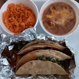 First taco was chicken, 1 tortilla and little filling. Tiny cup of rice, tiny cup of beans even the food had a sad face First taco was chicken, 1 tortilla and little filling. Tiny cup of rice, tiny cup of beans even the food had a sad face