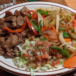 The carnitas have a tangy flavor - awesome work.  The veggies seasoned just right.