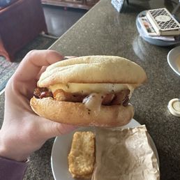 English muffin with egg, white cheddar, and bacon.