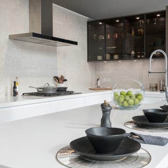 Porcelanosa - a modern kitchen with white countertops - Kitchen & Bath Near Me - Chestnut Hill, Massachusetts