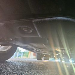 Wash N Lube - Oil leaking out of the car underneath.