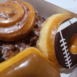 a variety of doughnuts in a box a variety of doughnuts in a box