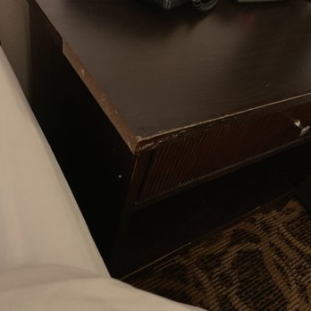 Quality Inn & Suites - Table between the beds coming apart - Hotels Near Me - Hobbs, New Mexico
