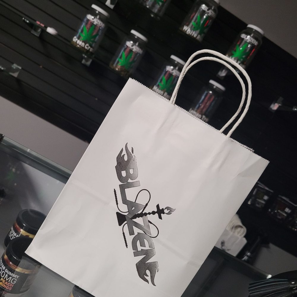 Blazen Hookah Lounge - a white paper bag with the word blaze on it - Hookah Bars Near Me - Middle River, Maryland