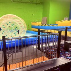 Left-rolling inflatable in a pool of water Right-hard to see but mechanical bull.
